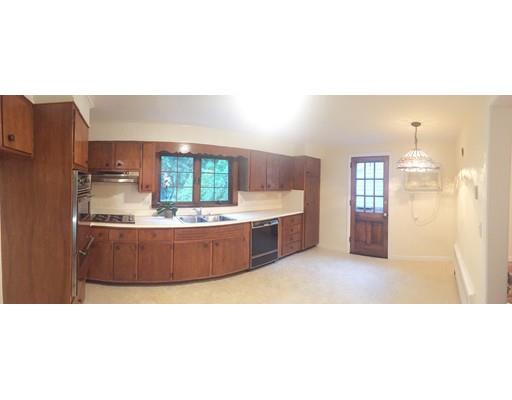 52 Meadowbrook Road Brookline, MA 02467 - Photo 6 of 20 a living room with a couch and a table