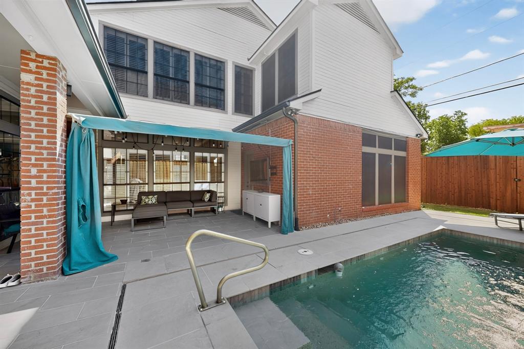 1526 Abrams Road Dallas, TX 75214 - Photo 33 of 38 Private backyard retreat featuring a covered patio and sparkling pool.