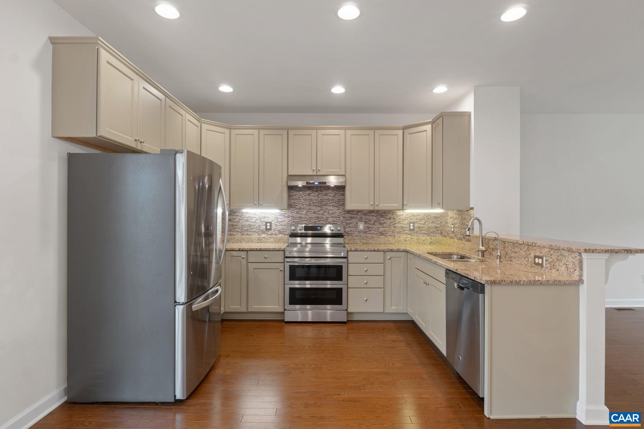 435 Rolkin Road Charlottesville, VA 22911 - Photo 11 of 56 a kitchen with stainless steel appliances granite countertop a refrigerator and a stove top oven