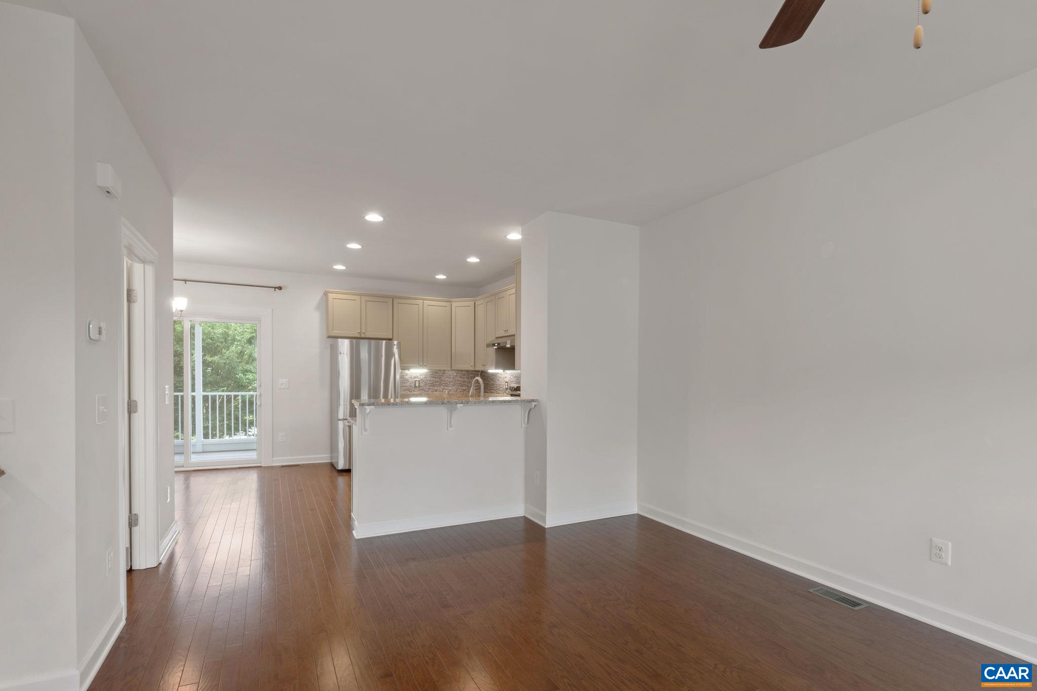435 Rolkin Road Charlottesville, VA 22911 - Photo 13 of 56 a view of a kitchen with wooden floor and a window