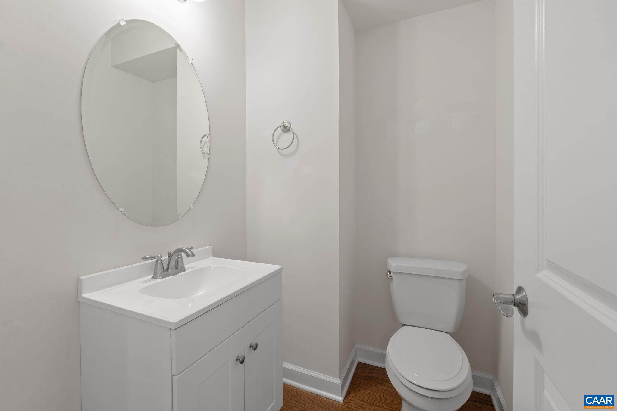 435 Rolkin Road Charlottesville, VA 22911 - Photo 16 of 56 a white toilet sitting next to a bathroom sink