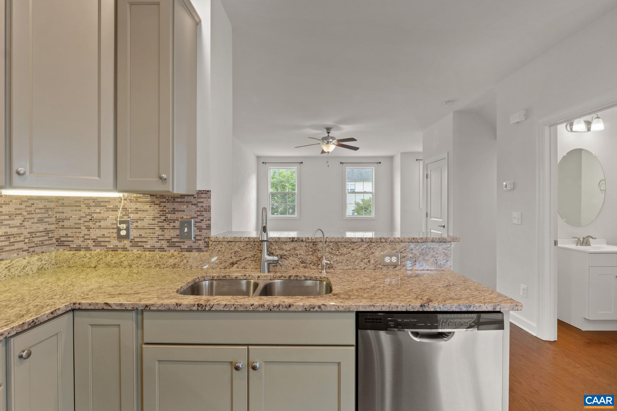 435 Rolkin Road Charlottesville, VA 22911 - Photo 10 of 56 a bathroom with a granite countertop sink and a mirror