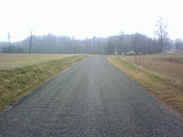 1072 Parrish Road Goodview, VA 24095 - Photo 2 of 3 a view of a field with trees in the background