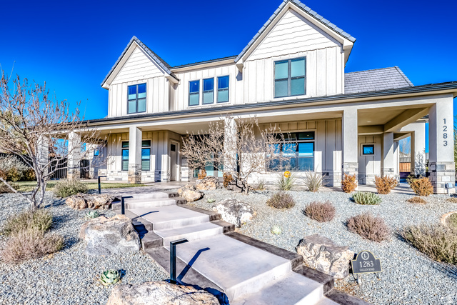 1283 North Gallen Road Santa Clara, UT 84765 - Photo 6 of 103 View of front of home featuring board and batten siding and covered porch