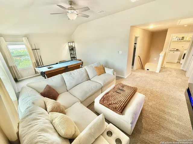 a living room with furniture and a couch