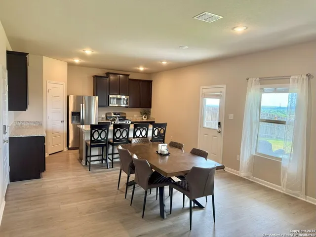 a view of a dining room with furniture