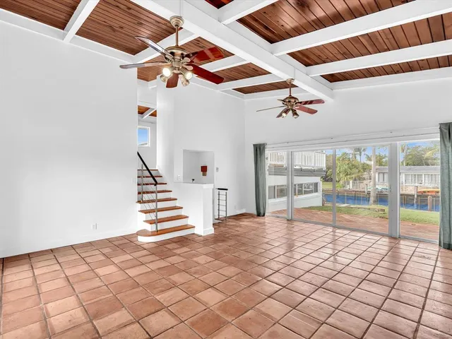 a bedroom with a large bed and a couch