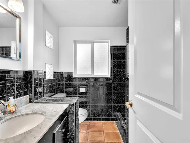 a view of a lake with a house and a ocean view