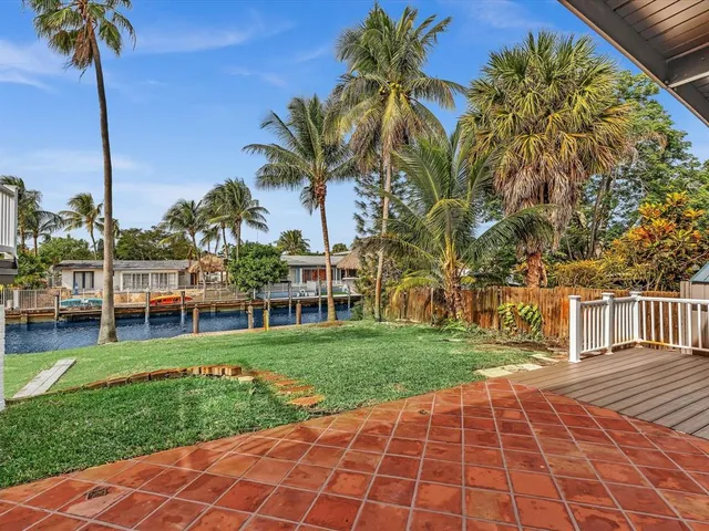a view of a kitchen with a sink and a refrigerator