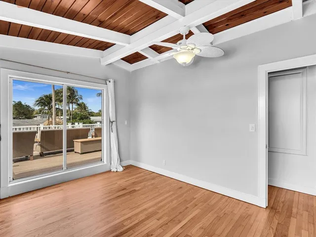a kitchen with granite countertop cabinets stainless steel appliances a sink and a window