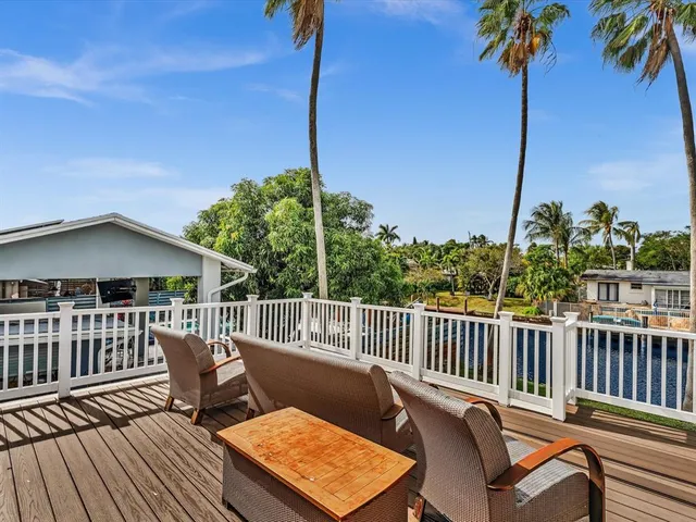 a picture of a room with a white wall and a large window