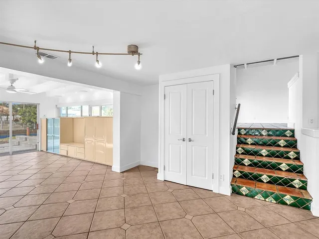 a view of a backyard with a table and chairs