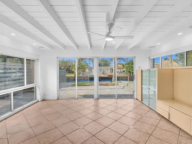 an aerial view of a house with garden space and trees
