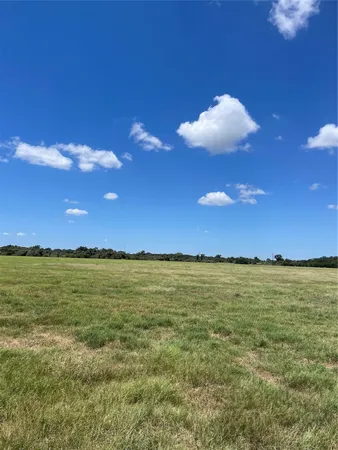 a view of an ocean and a yard
