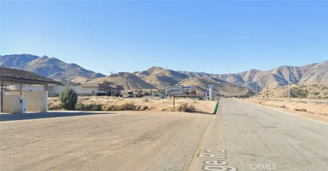 a view of a house with a yard and covered with snow