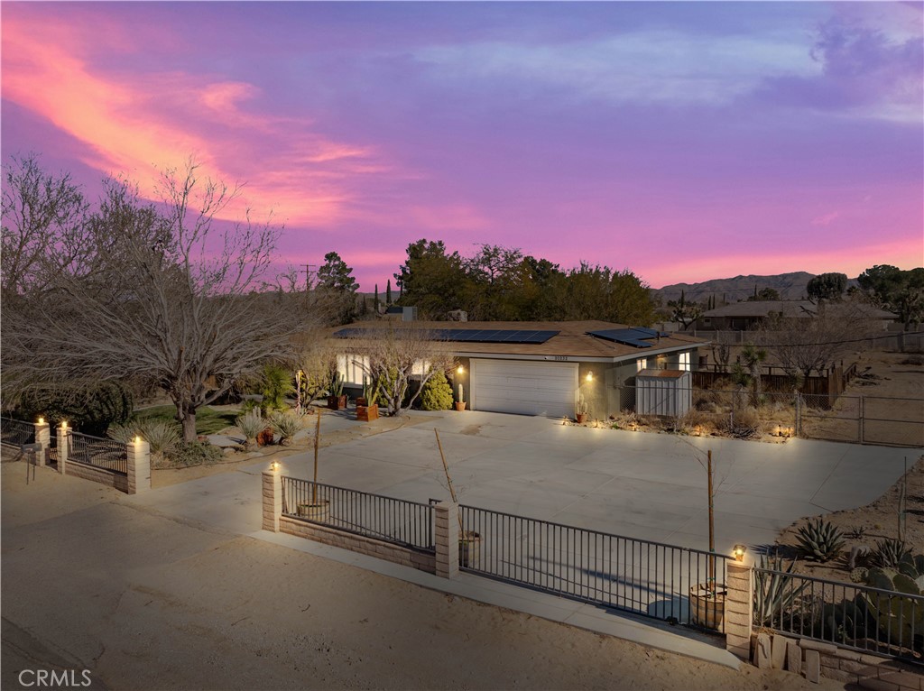 20232 Modoc Road Apple Valley, CA 92308 - Photo 1 of 1 a view of a terrace with a bench