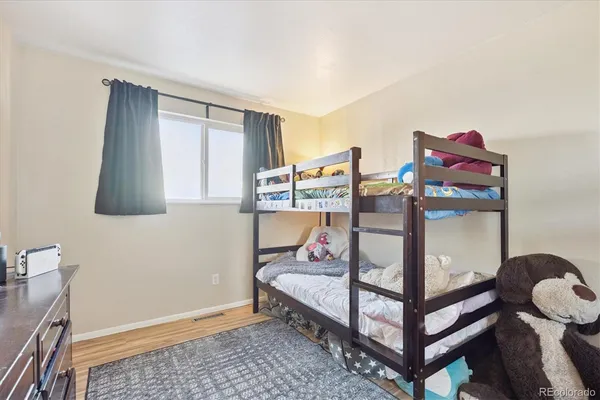 a bedroom with furniture and a window