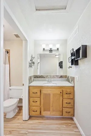 a room with a stove and a wooden floor