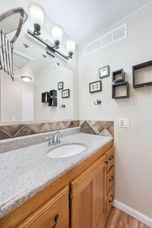 a bathroom with a sink double vanity and a mirror