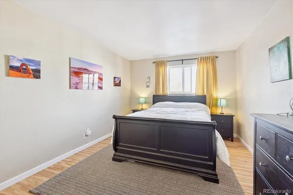 a bedroom with a bed and a cabinets