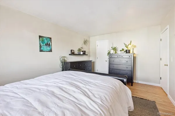 a bedroom with a bed and cabinets