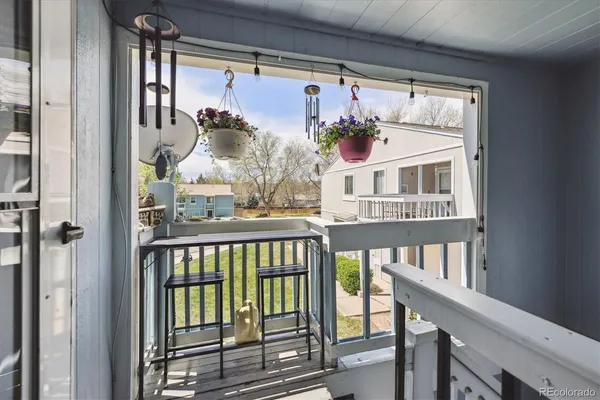 a view of a balcony from a dining room