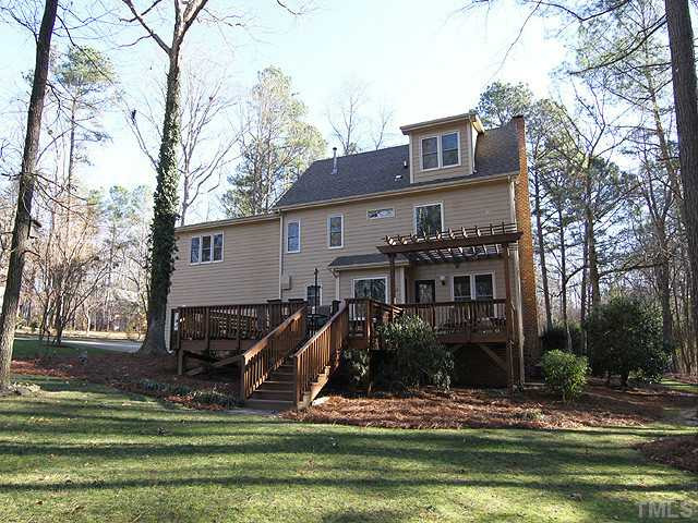 12025 Pembridge Lane Raleigh, NC 27613 - Photo 22 of 24 A view of the back of the home from the yard...room to play. Exterior Back