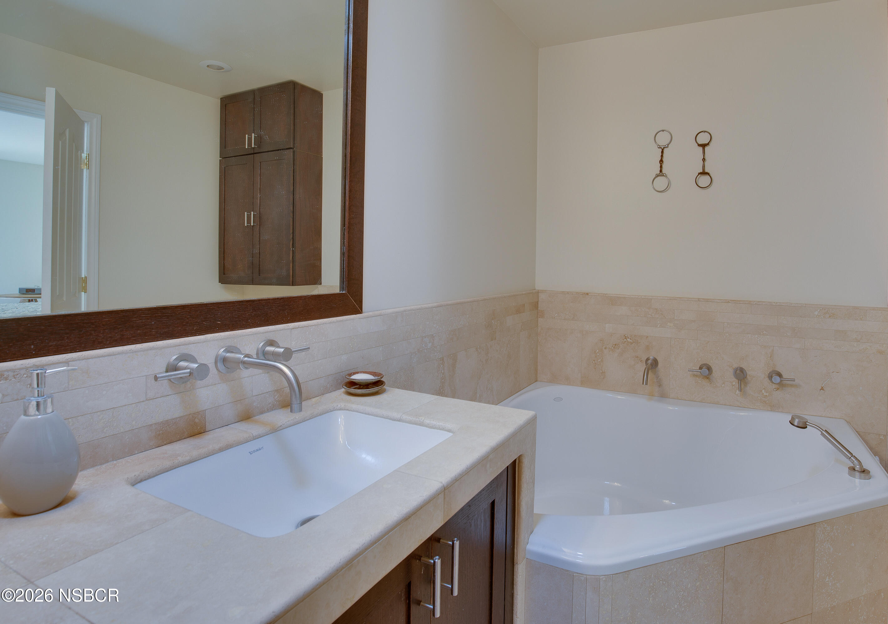 850 Fredensborg Canyon Road Solvang, CA 93463 - Photo 15 of 26 a bathroom with a bathtub and a sink