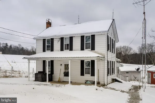 a aerial view of a house with a yard