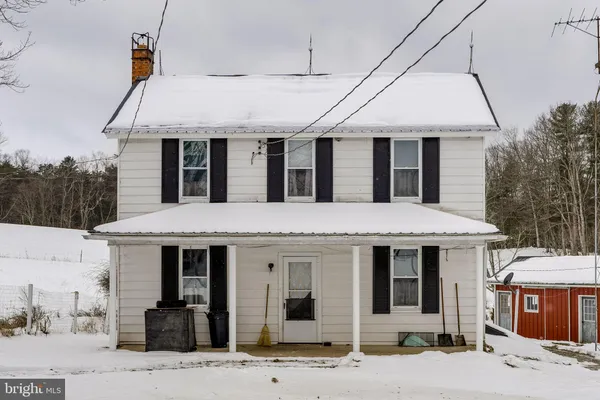 a front view of house with a yard