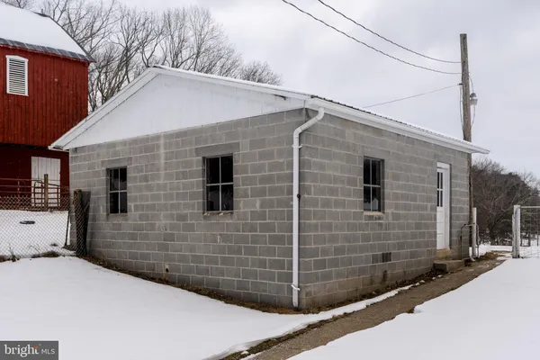 a kitchen with a refrigerator and a stove top oven