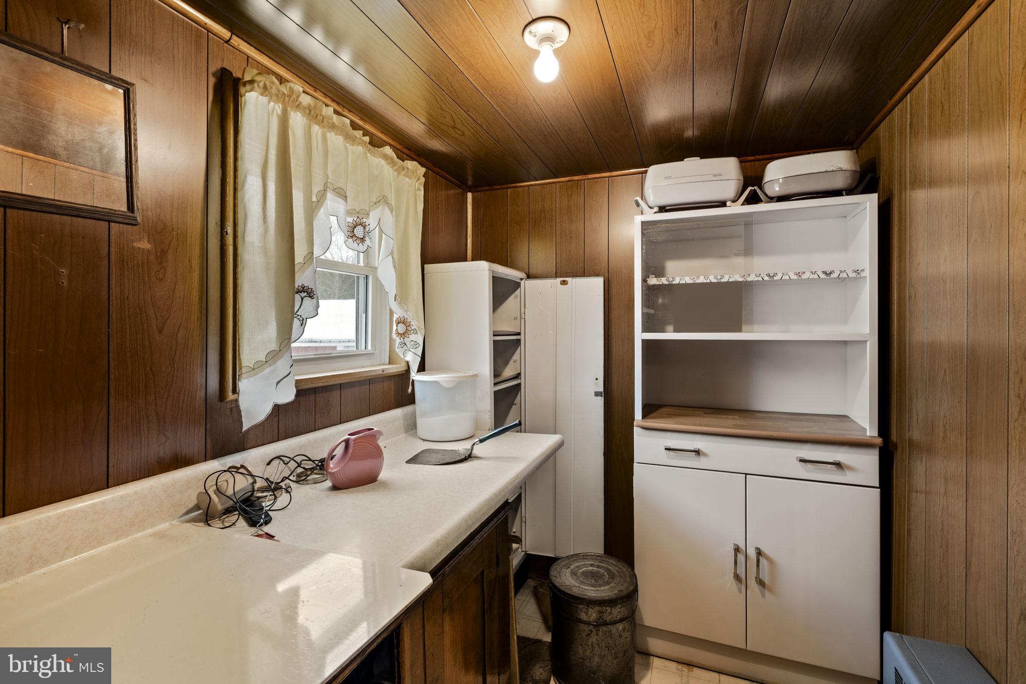 22314 Miller Road Shade Gap, PA 17255 - Photo 42 of 73 a bathroom with a sink vanity granite toilet and a mirror