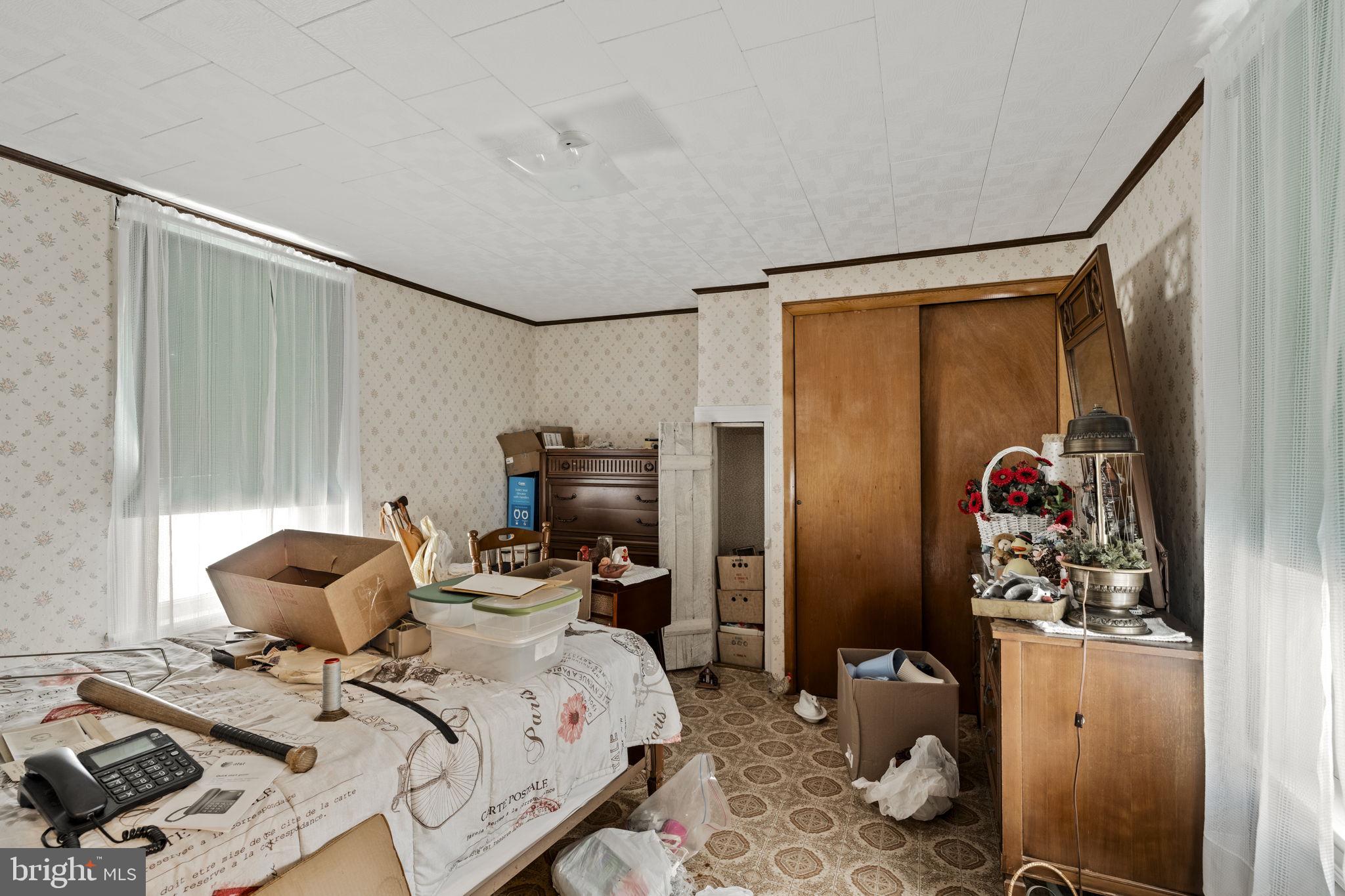 22314 Miller Road Shade Gap, PA 17255 - Photo 45 of 73 a bedroom with a bed and wooden floor