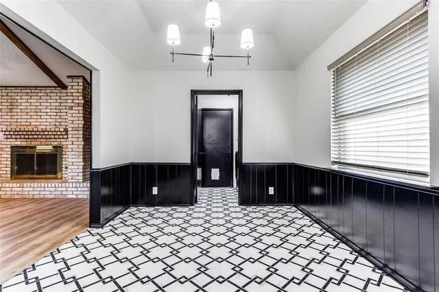 a room with a bed and a dresser