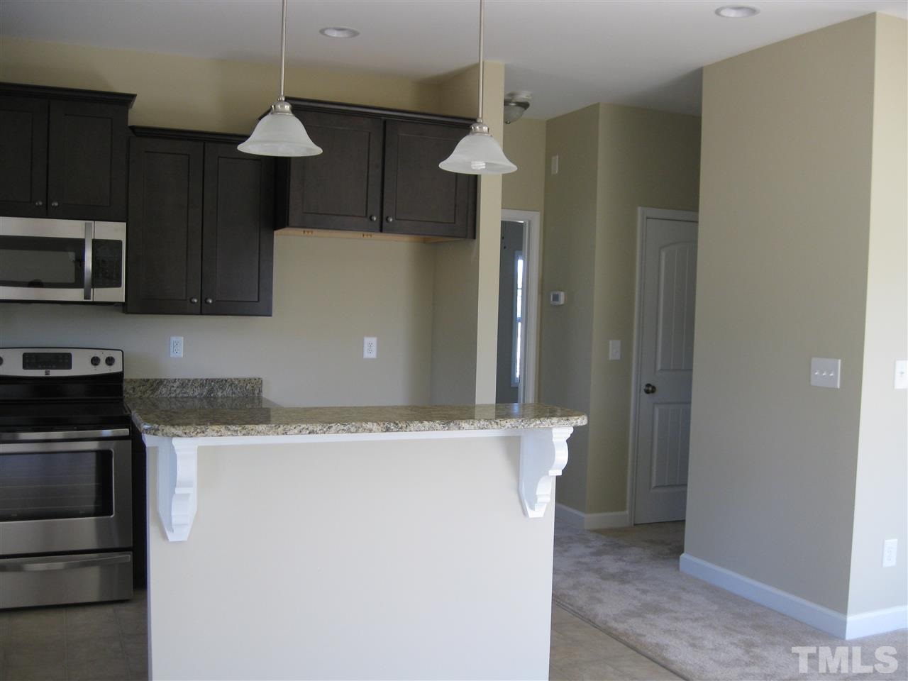8044 Creech Road Middlesex, NC 27557 - Photo 8 of 14 Just down the hall from the kitchen you will find access to your half bath and laundry room, which leads to the 2 car garage.