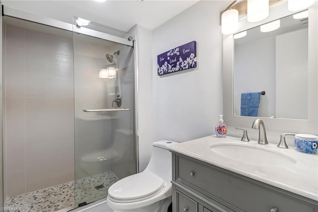 5 High Point Circle West, Unit 101 Naples, FL 34103 - Photo 14 of 40 Primary Bathroom