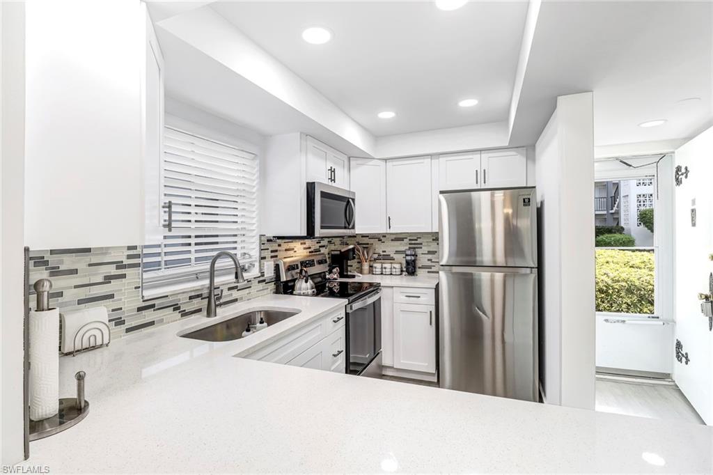 5 High Point Circle West, Unit 101 Naples, FL 34103 - Photo 3 of 40 Kitchen