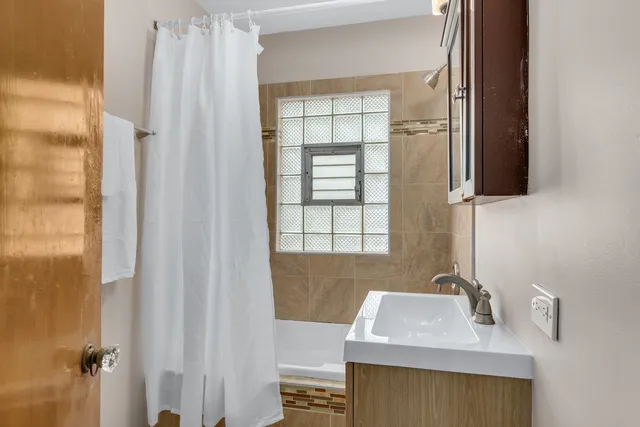a bathroom with a sink and a mirror