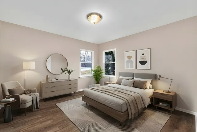 a bedroom with bed and a window