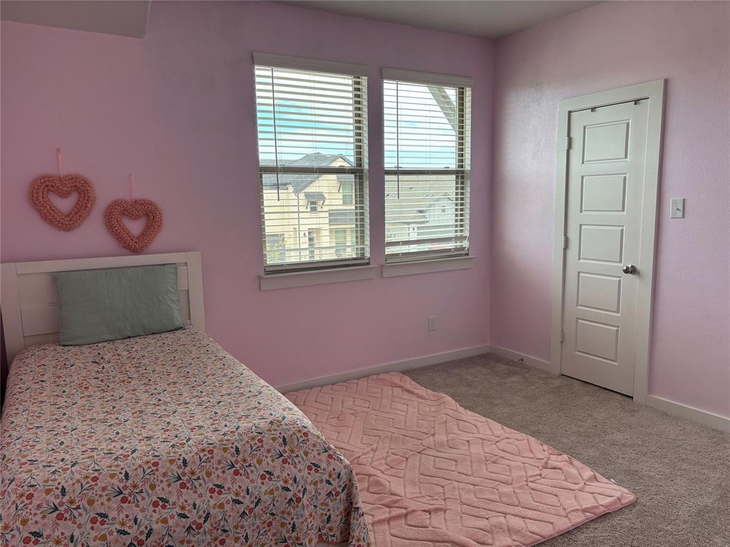 2029 Dovedale Drive Forney, TX 75126 - Photo 16 of 18 a bedroom with a bed and a window
