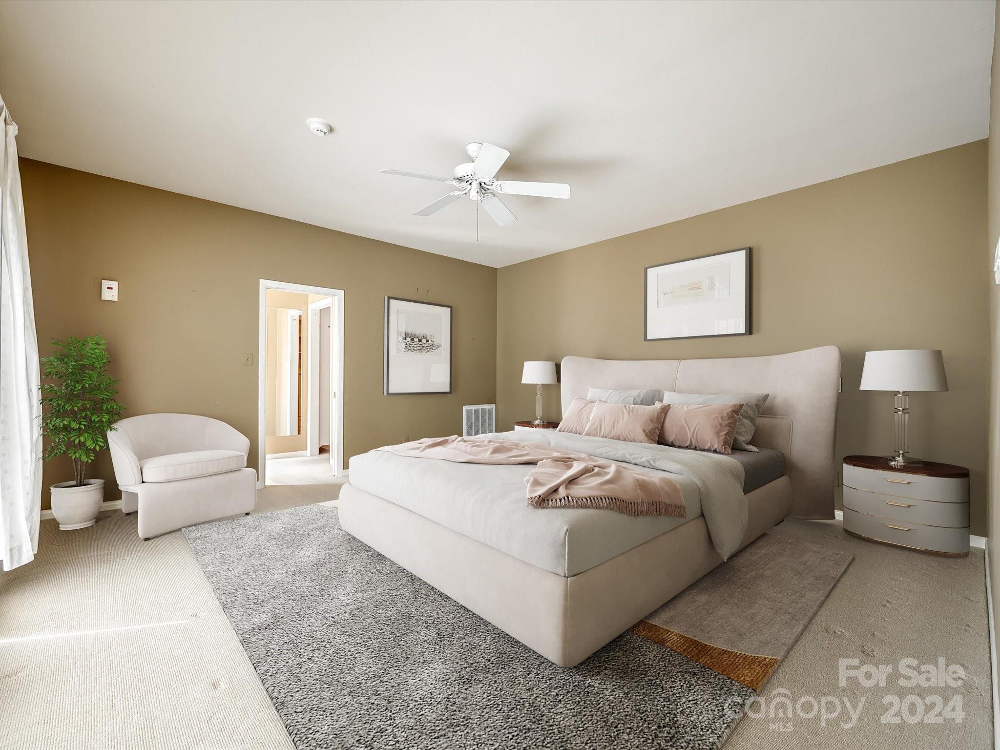 4001 Rounding Run Road Charlotte, NC 28277 - Photo 18 of 42 a spacious bedroom with a bed a couch and a chandelier