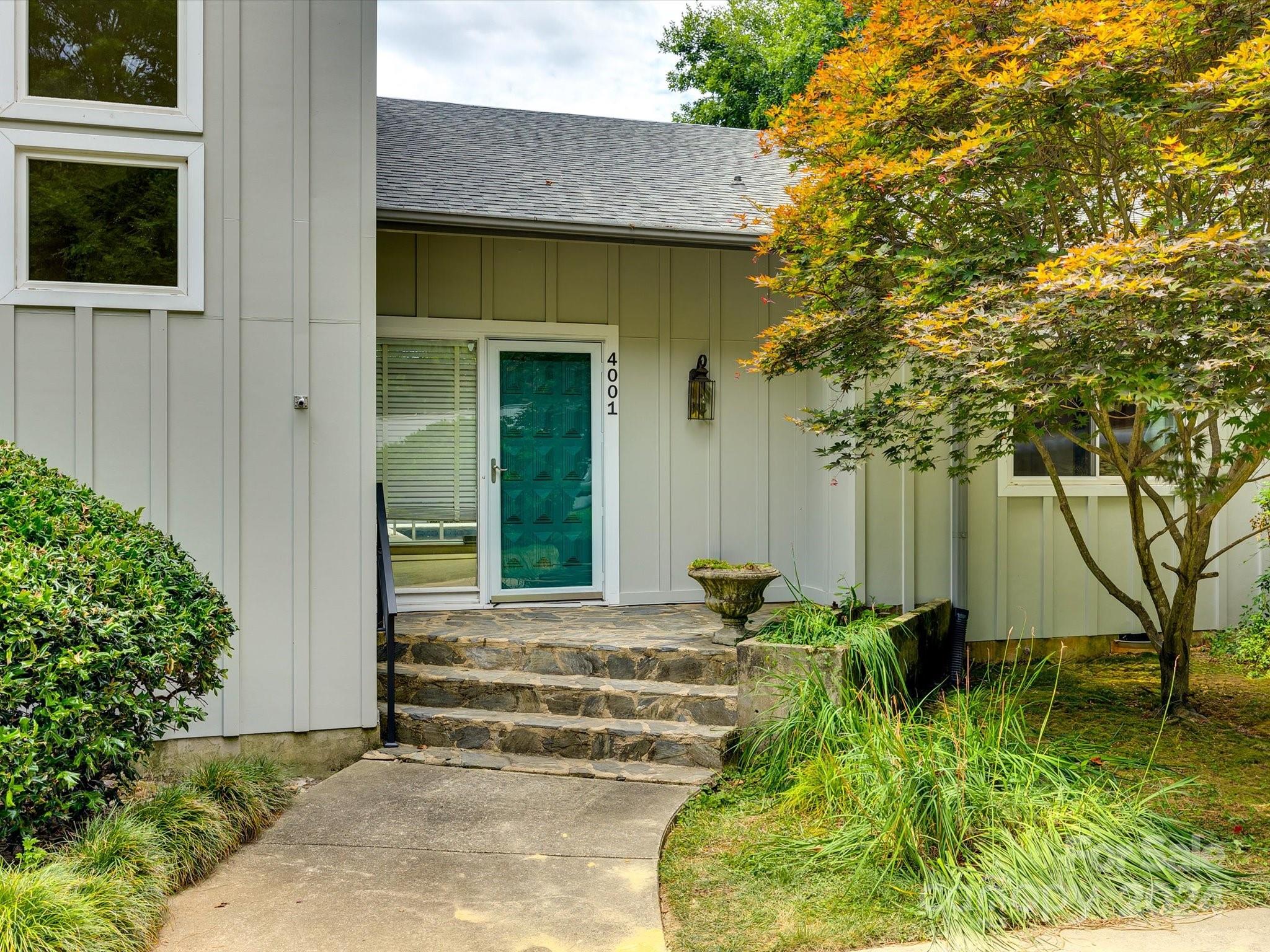 4001 Rounding Run Road Charlotte, NC 28277 - Photo 5 of 42 a front view of a house with garden
