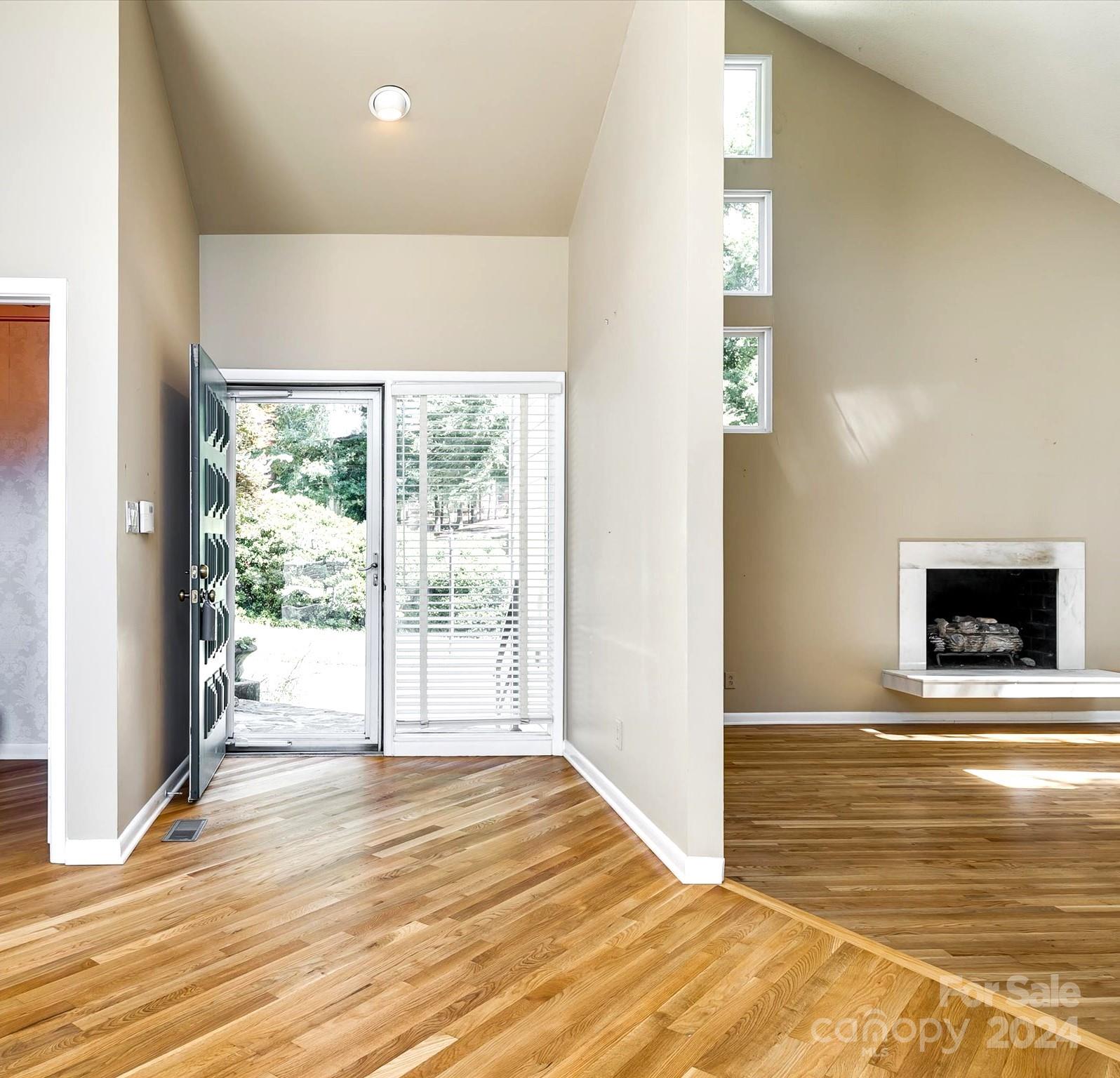 4001 Rounding Run Road Charlotte, NC 28277 - Photo 6 of 42 a view of an empty room with window and a fireplace