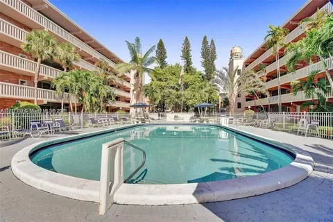 a view of a swimming pool with a balcony