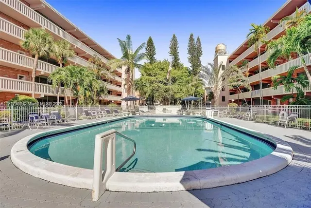 a view of a swimming pool with a balcony