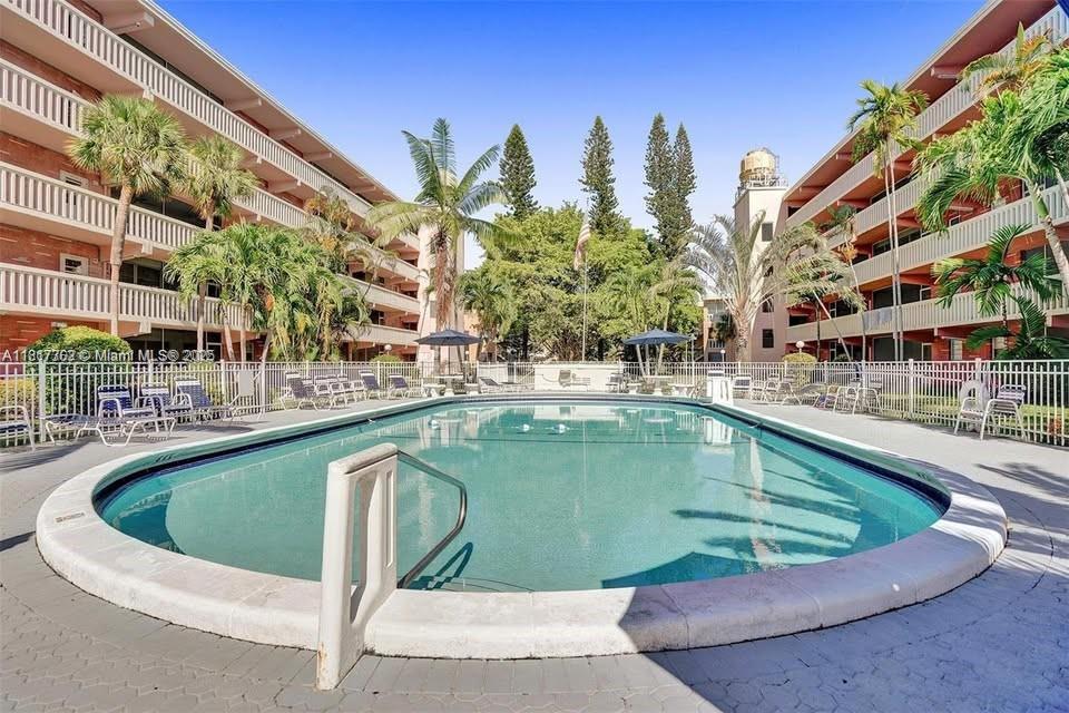 a view of a swimming pool with a balcony