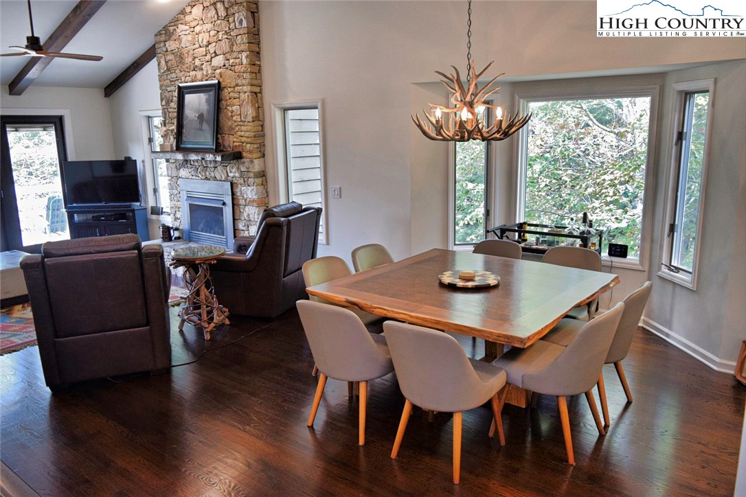 250 Ascot Lane Boone, NC 28607 - Photo 12 of 44 a view of a dining room with furniture window and wooden floor
