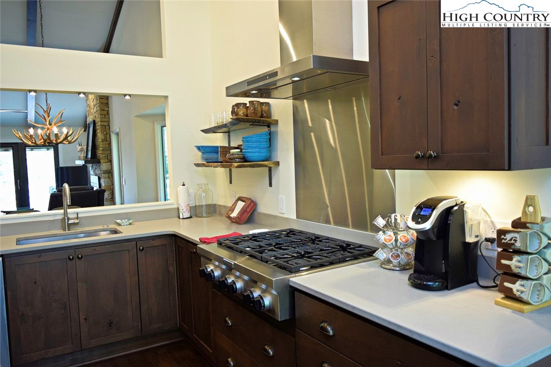 250 Ascot Lane Boone, NC 28607 - Photo 18 of 44 a kitchen with a sink a stove and cabinets