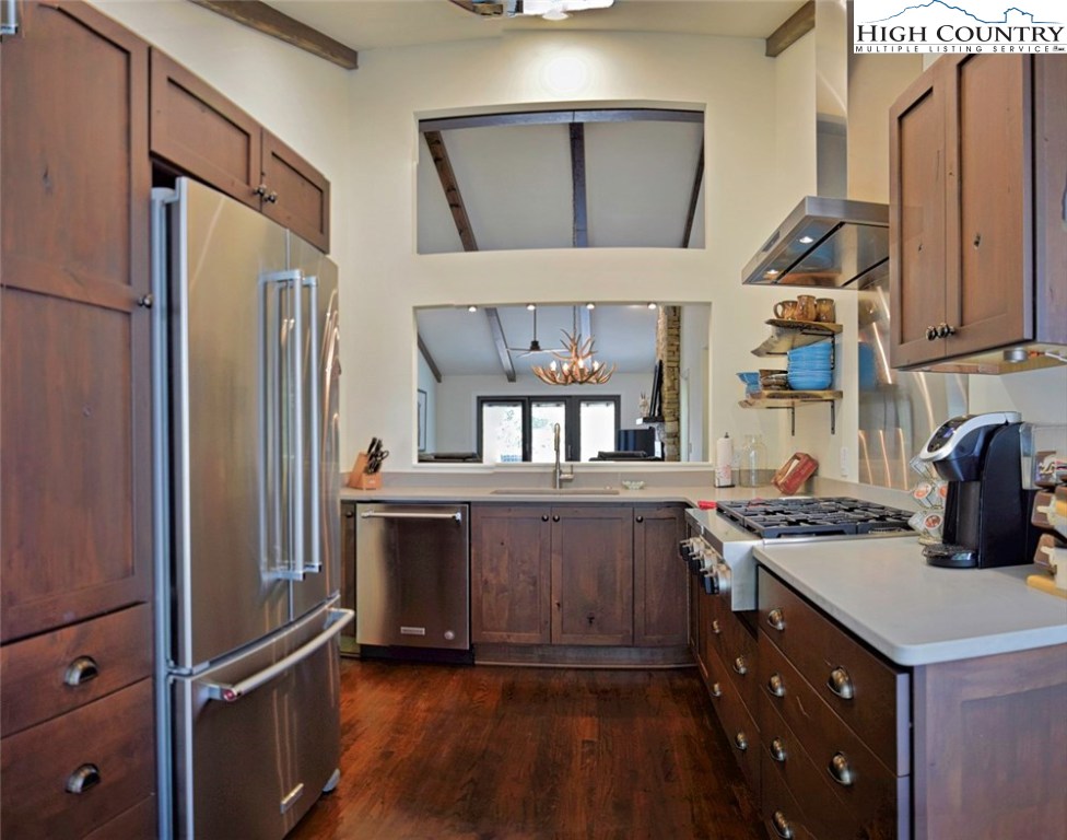 250 Ascot Lane Boone, NC 28607 - Photo 21 of 44 a kitchen with a refrigerator a sink and cabinets