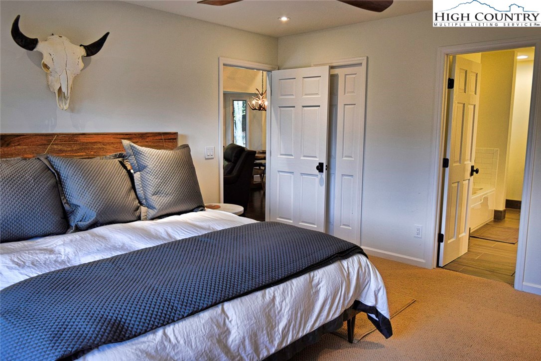 250 Ascot Lane Boone, NC 28607 - Photo 24 of 44 a bedroom with a bed and dresser